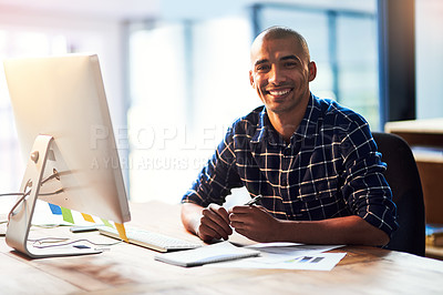 Buy stock photo Portrait of a young designer working at his office desk