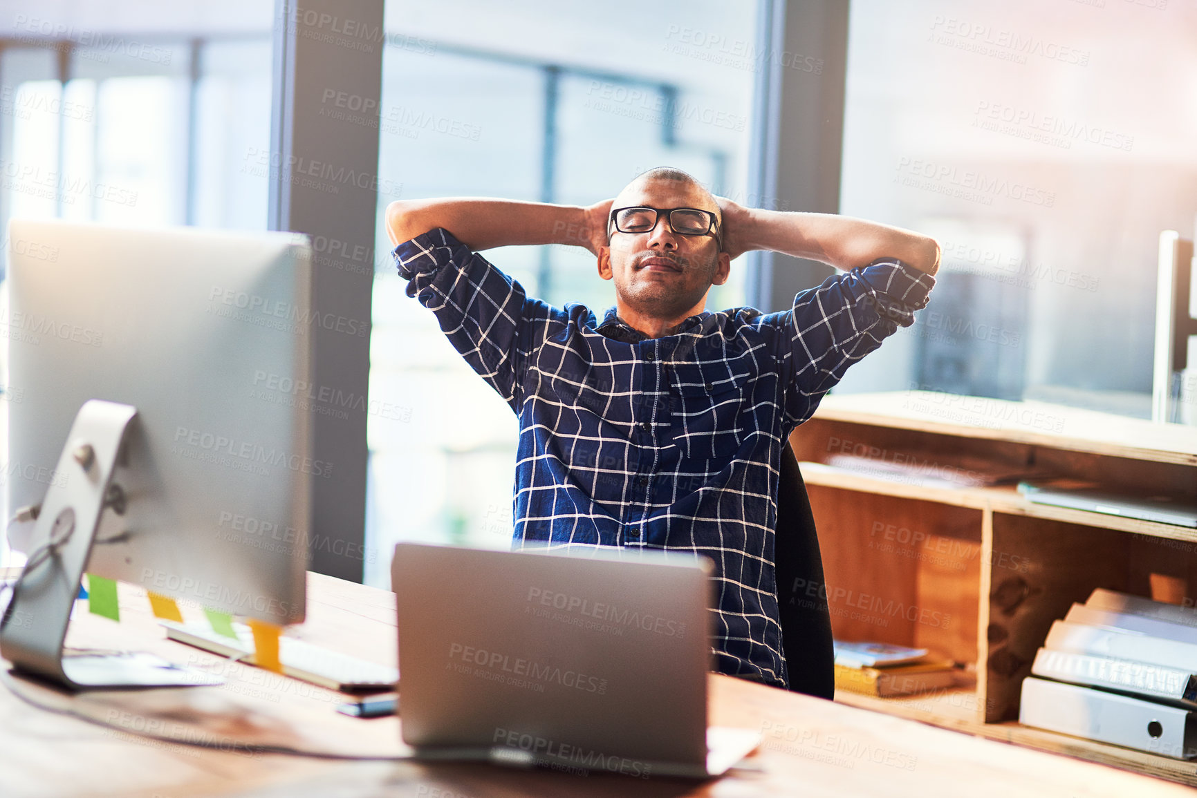 Buy stock photo Finish, man and graphic designer in office to relax for complete task, break and news by computer. End, laptop and creative worker in startup workplace for resting, calm peace and stretching arms