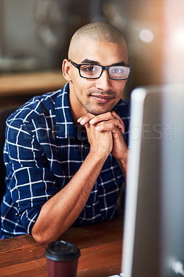 Buy stock photo Portrait, glasses and creative business man on computer in startup office for career and job in Brazil. Face, confident professional and entrepreneur on desktop for email or project of copywriter