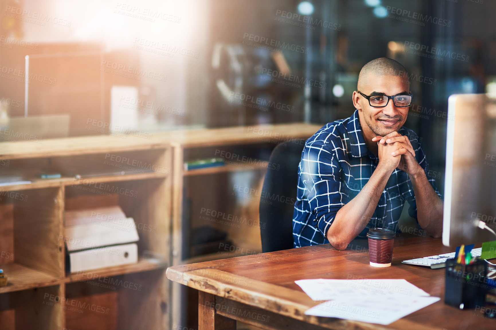 Buy stock photo Portrait of a young designer working at his office desk