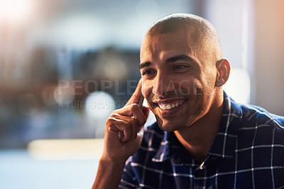 Buy stock photo Cropped shot of a young designer talking on a cellphone
