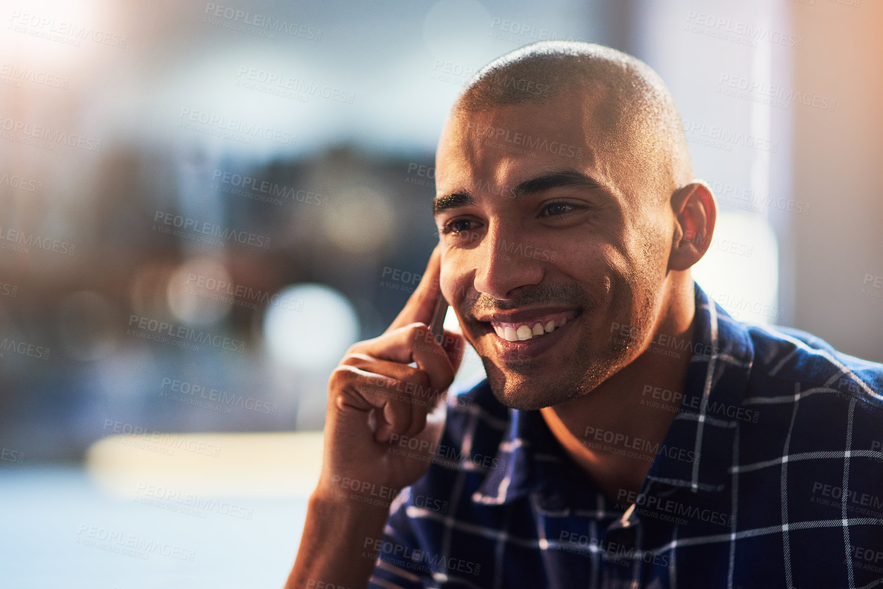 Buy stock photo Cropped shot of a young designer talking on a cellphone