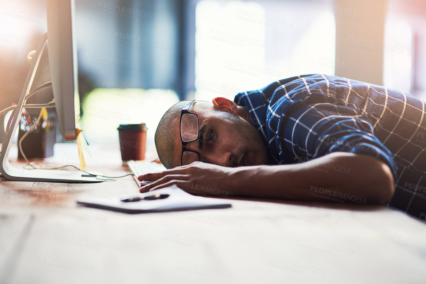 Buy stock photo Business man, sleeping and tired by computer for fatigue, overworked or deadline in office. Programmer or developer with depression, burnout or worried for information technology career or startup