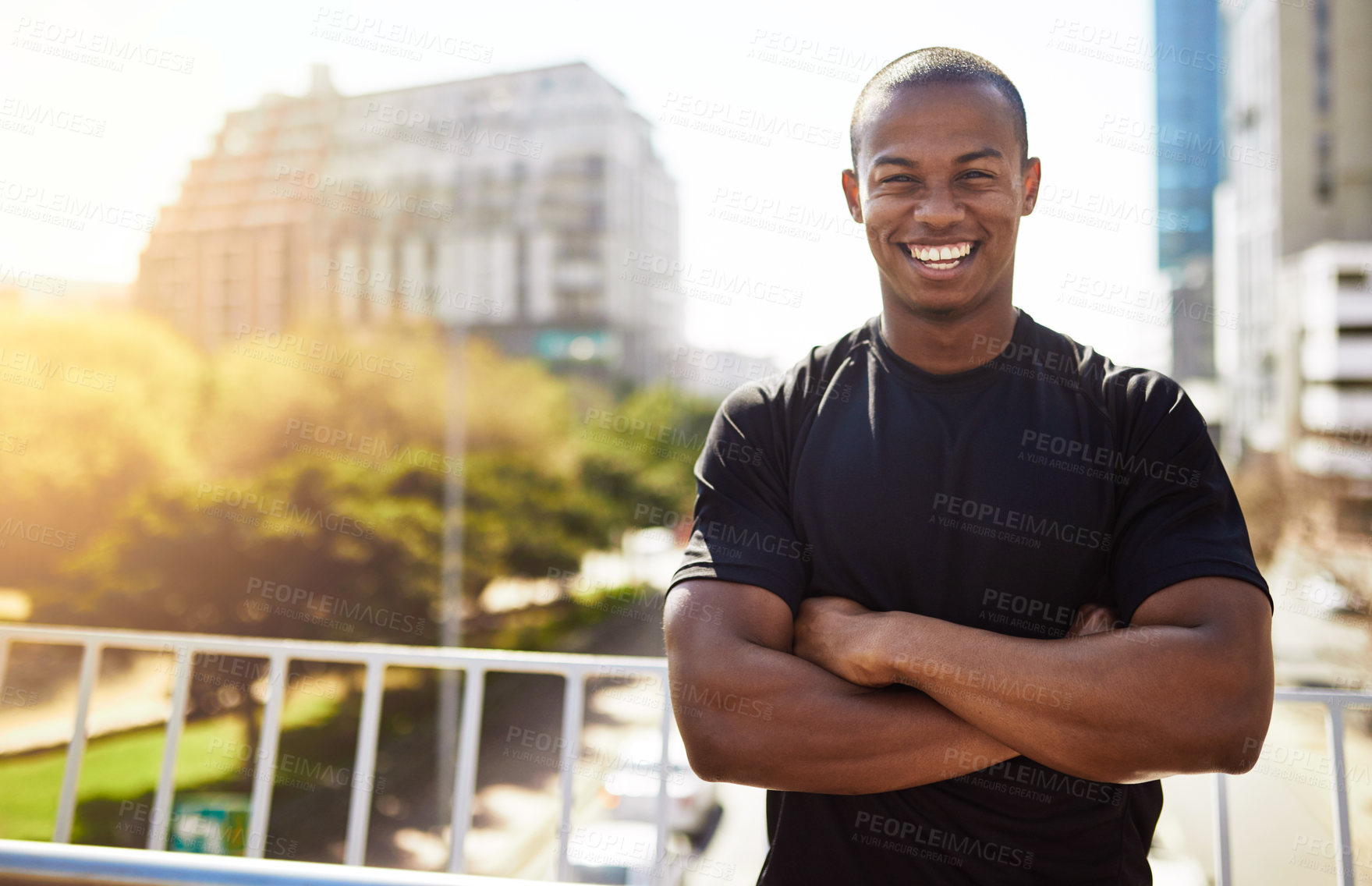 Buy stock photo Fitness, man and portrait with arms crossed in city for morning jog, exercise and confidence for workout. Athlete, runner and person with smile on bridge for running challenge, marathon and wellness