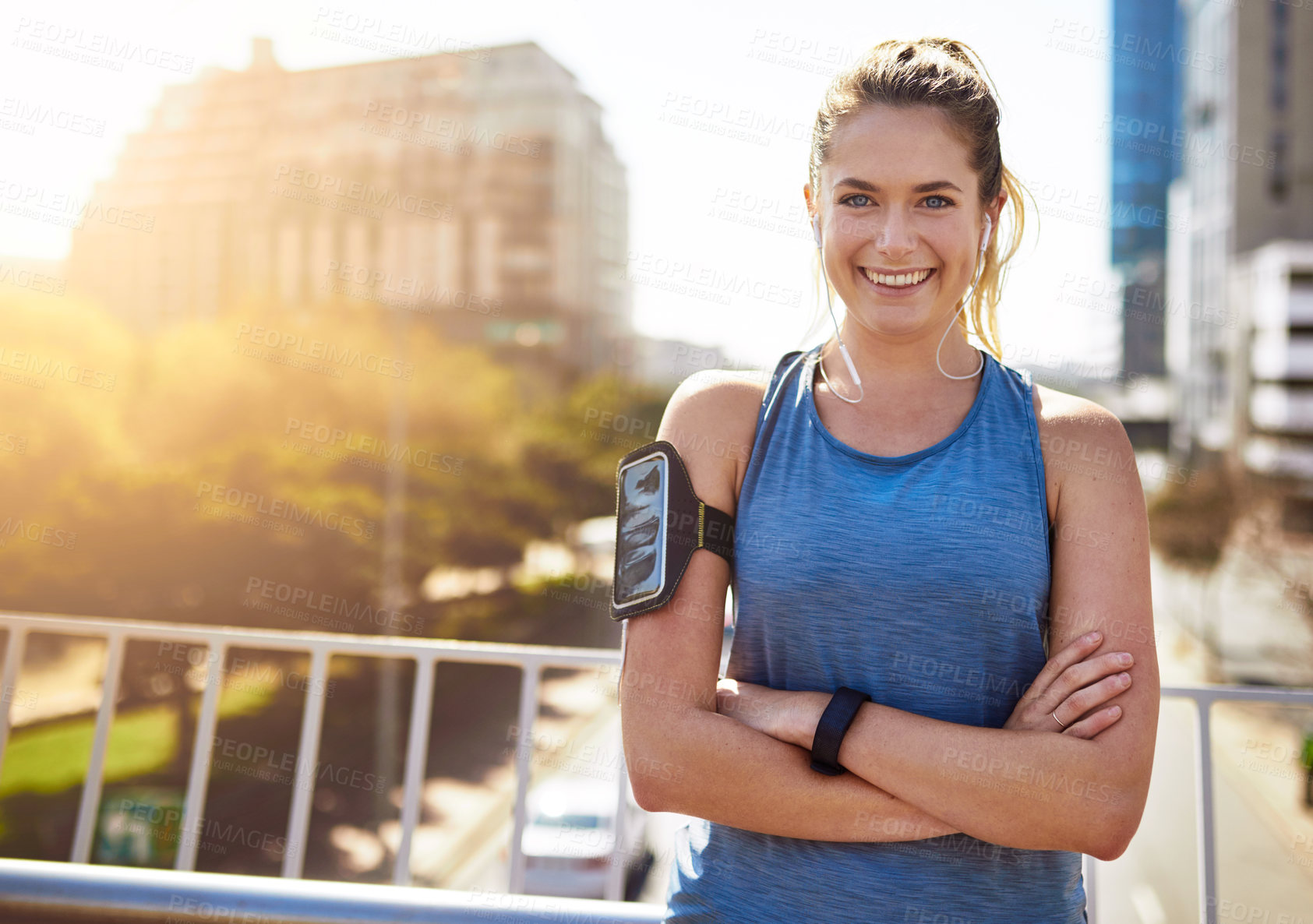 Buy stock photo Fitness, woman and portrait with arms crossed outdoor for morning jog, exercise or music for workout. Athlete, runner and person with smile on city bridge for running challenge, marathon or earphones