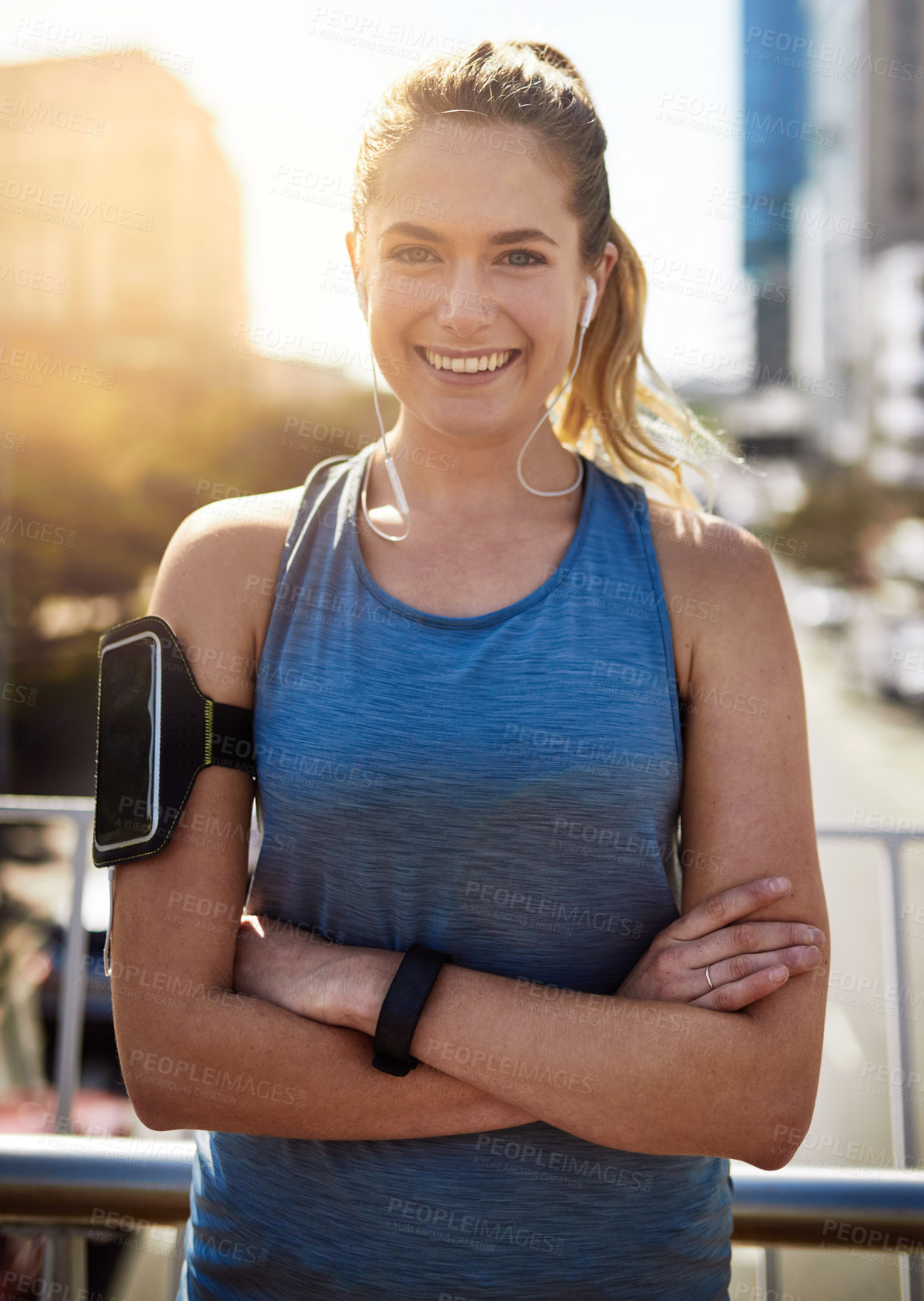 Buy stock photo Fitness portrait, woman and music with arms crossed outdoor for morning jog, exercise or earphones for workout. Athlete, runner and person with smile on city bridge for running challenge and marathon