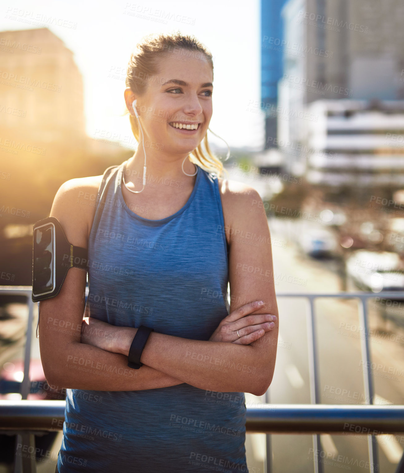 Buy stock photo Happy, arms crossed and woman with earphones, fitness and smile for workout, break and listening to music. Outdoor, training and radio for exercise, lens flare and ideas for routine and audio