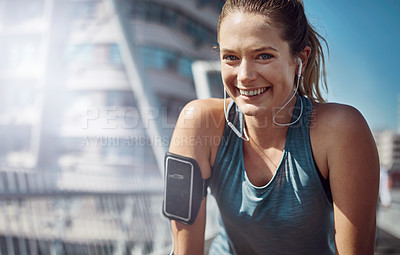 Buy stock photo Portrait of a sporty young woman looking tired during a run