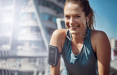 Buy stock photo Portrait, happy woman and runner in city with earphones for morning jog, exercise or outdoor workout. Athlete, training break or tired girl on bridge for running challenge, fitness and music playlist