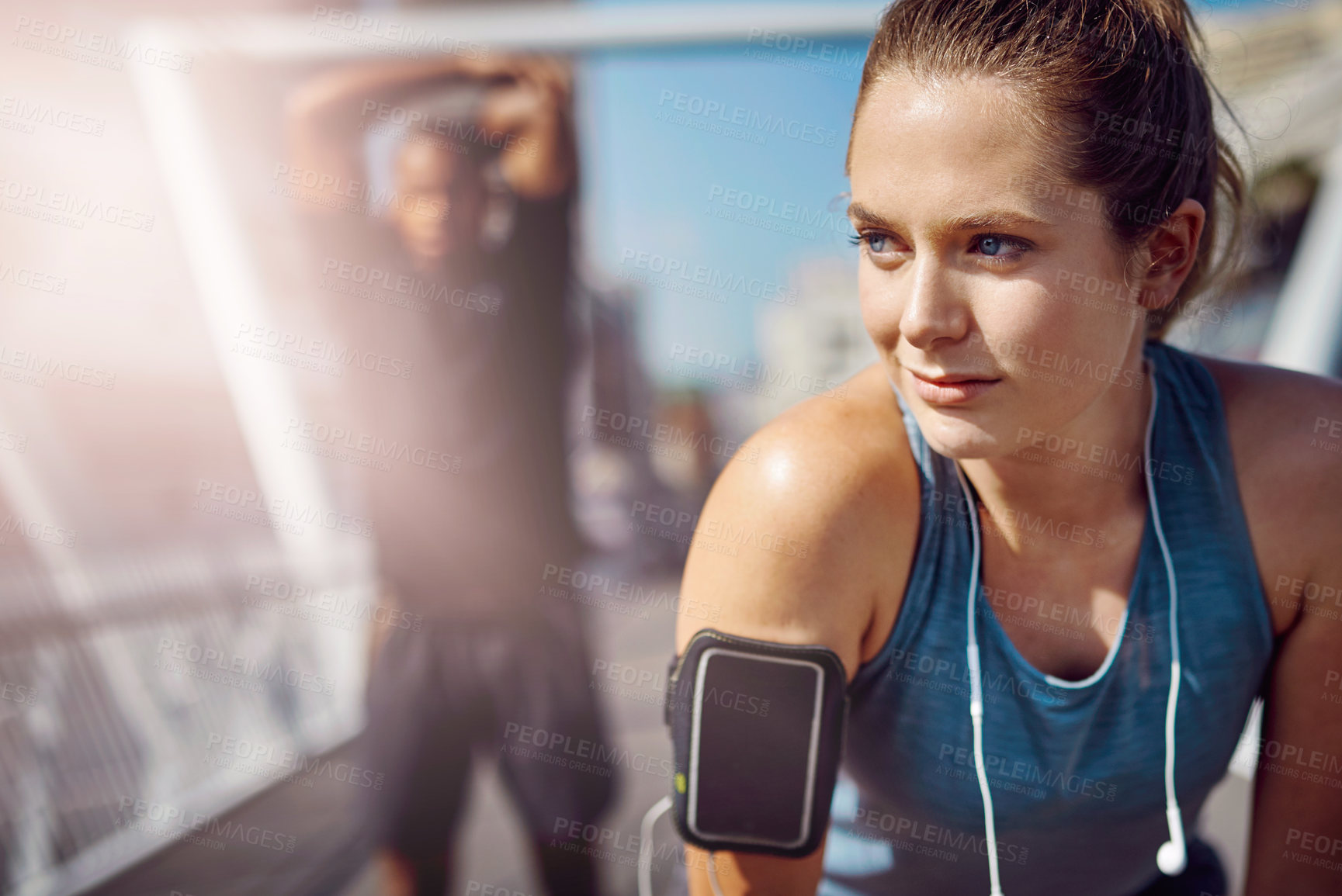 Buy stock photo Woman, runner and smile with rest on bridge for reflection, progress and blank phone screen with mockup space. Person, breathe and thinking in city with wearable tech, exercise or training in morning