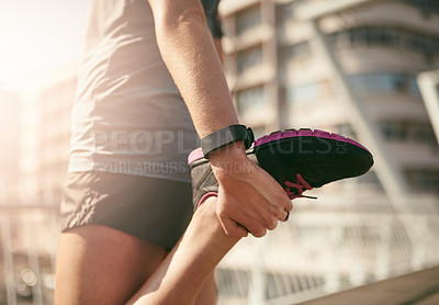 Buy stock photo Woman, hands and stretching with foot in city for exercise or workout preparation on bridge. Closeup, female person or runner getting ready in warm up for balance or outdoor training in an urban town