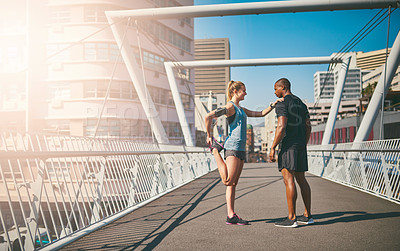 Buy stock photo Woman, man and stretching legs on bridge with warm up for muscle, health and start training in city. People, partnership and ready in profile for exercise, fitness and workout for wellness in morning