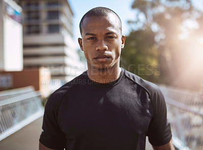 Buy stock photo Portrait of a sporty young man standing outdoors