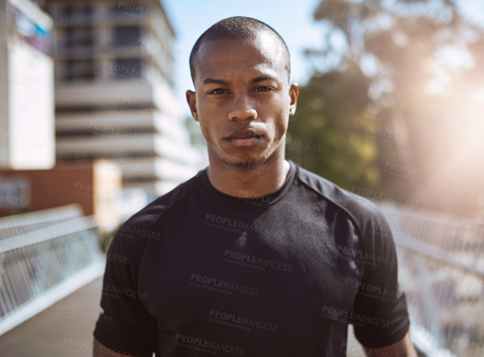 Buy stock photo Portrait of a sporty young man standing outdoors