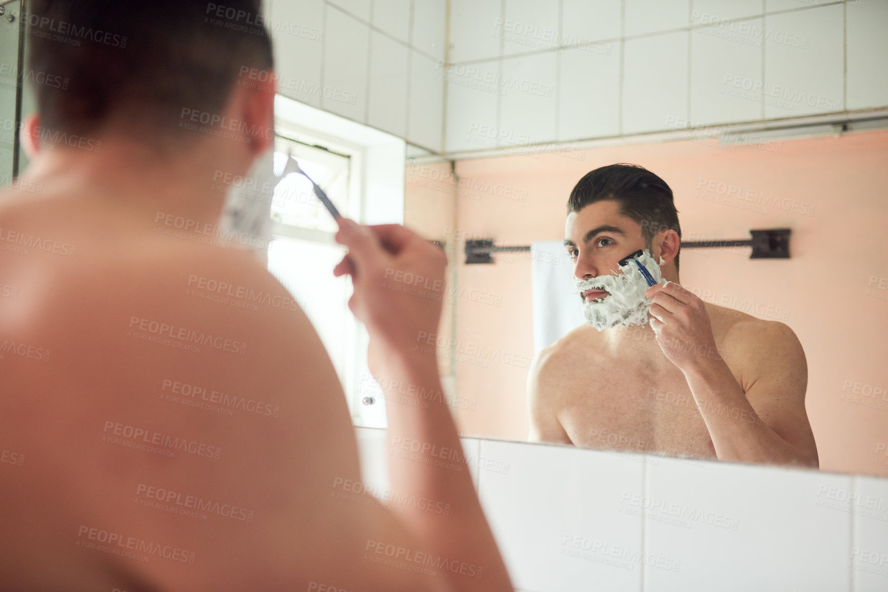 Buy stock photo Mirror, cream and man in bathroom for shaving for skincare, morning routine and facial transformation for beard. Cleaning, reflection and guy with foam for hair removal and razor product for results