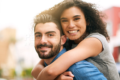 Buy stock photo Shot of a playful couple out in the city together