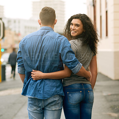Buy stock photo Shot of a loving couple out in the city