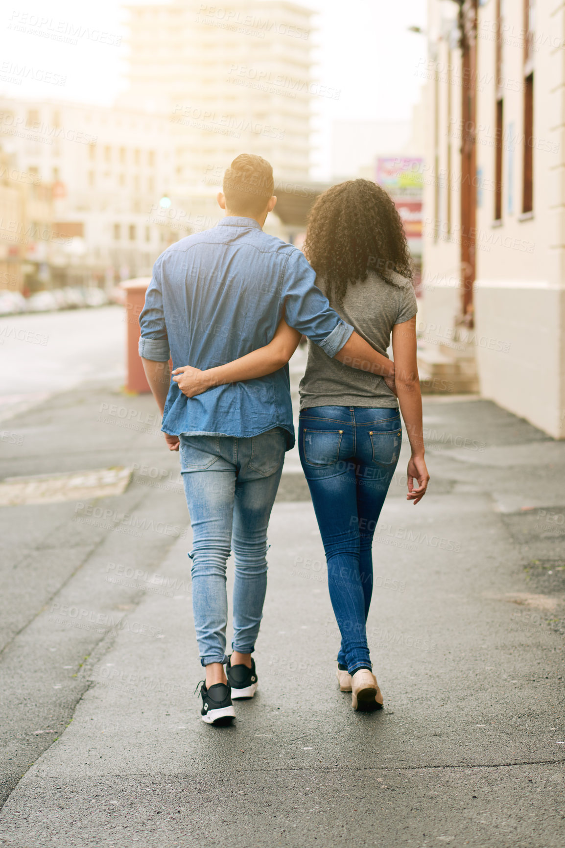 Buy stock photo Walking, hugging and back of couple on street in city for outdoor exploring on vacation together. Love, embracing and people commuting in road for tourism on holiday or weekend trip in urban town.