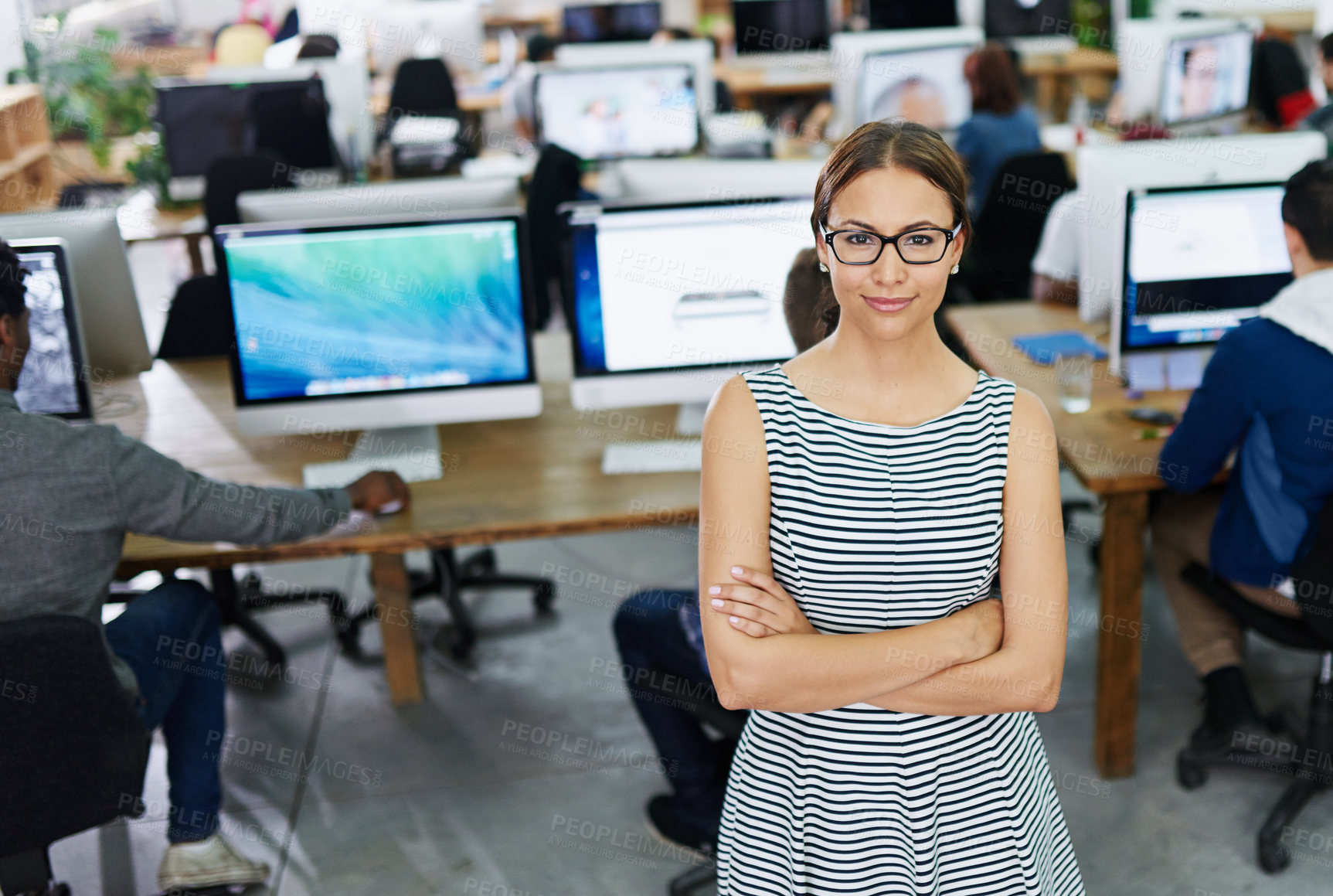 Buy stock photo Portrait, arms crossed and woman with glasses, office and proud of startup, coworking and internship. Creative, graphic designer and girl with confidence, vision and happy with screen of computer