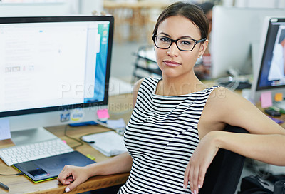 Buy stock photo Portrait of an smiling young designer sitting at a computer in an office