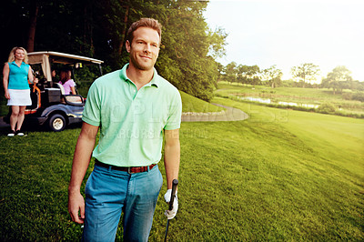 Buy stock photo Shot of a man playing a round of golf with his friends