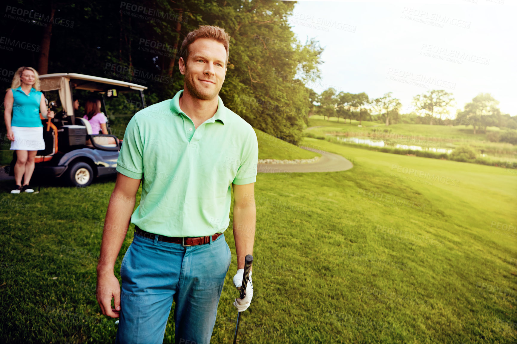 Buy stock photo Shot of a man playing a round of golf with his friends