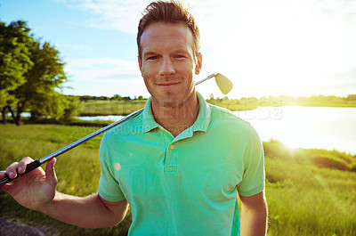 Buy stock photo Portrait of a young man spending the day on a golf course