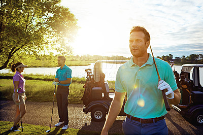 Buy stock photo Shot of a man playing a round of golf with his friends