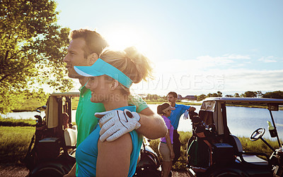 Buy stock photo Shot of two couples playing a round of golf together on a sunny day
