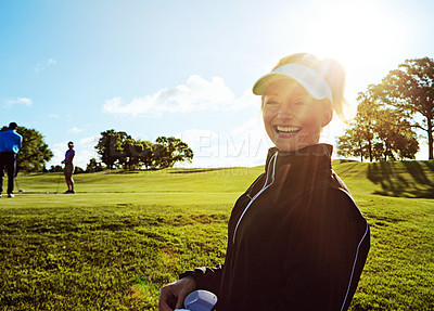 Buy stock photo Shot of a woman spending the day on a golf course