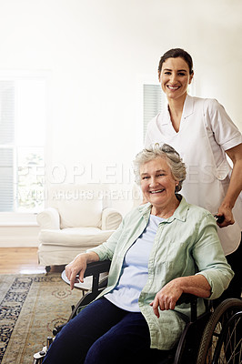 Buy stock photo Portrait of a smiling caregiver and a senior woman in a wheelchair at home