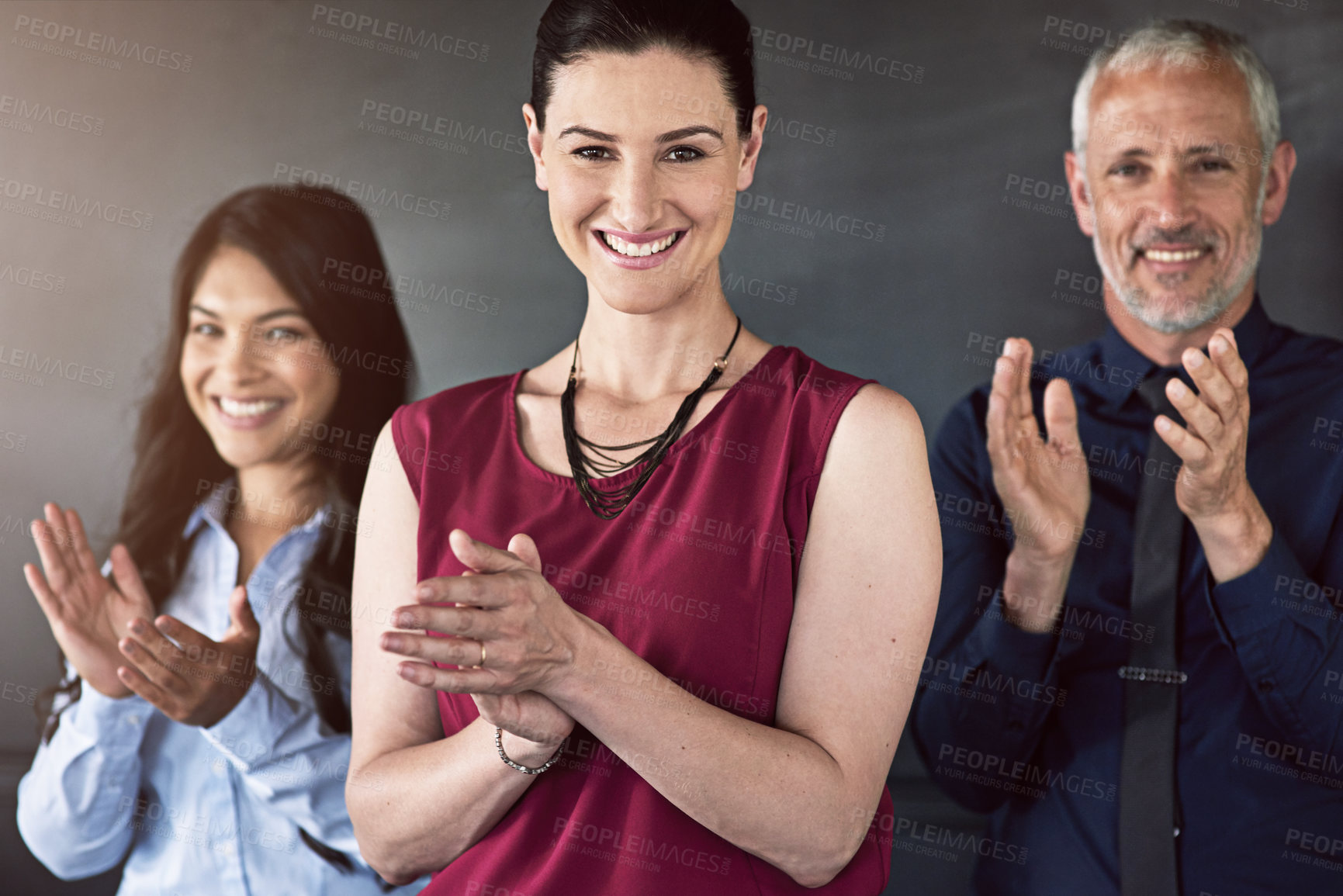 Buy stock photo Studio portrait of a group of coworkers giving you a round of applause