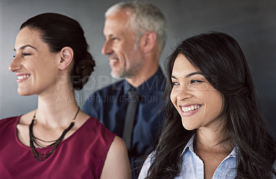 Buy stock photo Shot of a group of coworkers standing in the studio