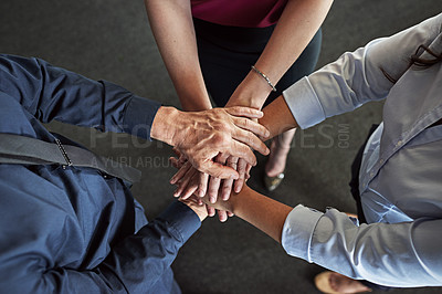 Buy stock photo High angle shot of a group of businesspeople's hands in a huddle