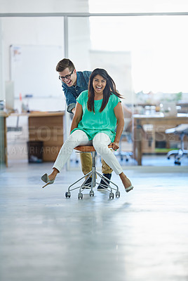 Buy stock photo Office, laughing or business women push chair for happiness, investment growth or startup success in company workspace. Friends, fun and people with excited face for playing, achievement and win
