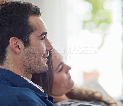 Buy stock photo Love, relax and couple on a sofa with care, trust and support while bonding in their home together. Face, smile and people in a living room with security, safety and enjoying calm weekend in a house