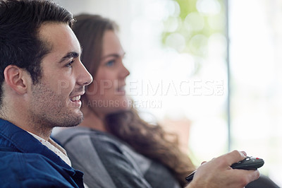 Buy stock photo Remote control, love and couple watching tv in house with streaming, service or sign up subscription. Television, movie or people in living room with cinema film, show or media in their home together