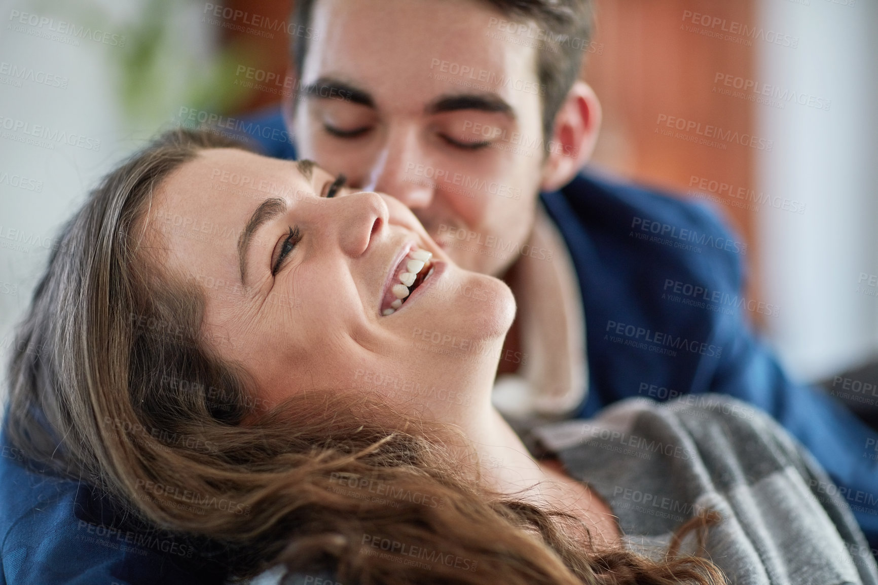 Buy stock photo Face, love and smile with couple in living room of home together for bonding, romance or trust. Funny, laughing or relax with happy man and woman in apartment for comedy, humor or weekend fun