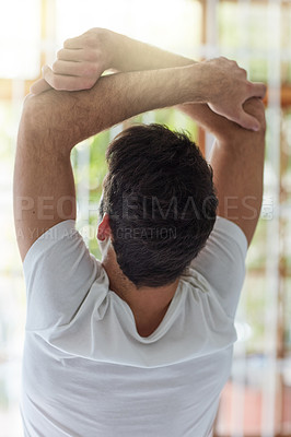 Buy stock photo Awake, back and stretching with man in bedroom of home to start morning warm up on weekend. Lazy, relax and rest with person in apartment to enjoy free time on Saturday or Sunday for recovery