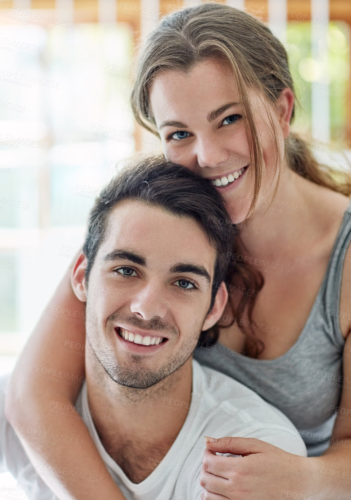Buy stock photo Couple, together and smile for hug, portrait and love in house, weekend and morning to relax for romance. Apartment, woman and man in embrace for marriage, break and bonding with care in home