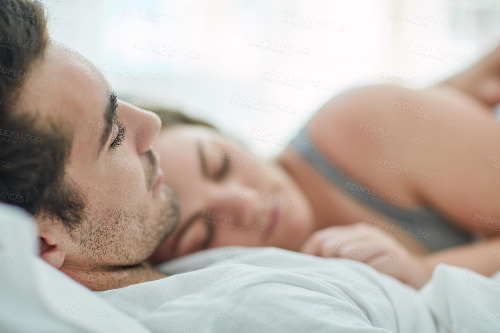 Buy stock photo Sleeping, love and couple hug in bed with peace, safety and security, comfort and bonding in their home. Relax, sleep and people in bedroom with nap, snooze or lazy morning, dream or rest in a house