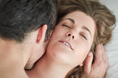 Buy stock photo Kiss, love and couple in bed with romance, intimacy and desire, connection and bonding in their home from above. Foreplay, top view and people in a bedroom with passion for honeymoon or anniversary