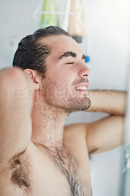 Buy stock photo Shower, smile and water for body, man and splash on face, morning and washing in apartment for hygiene. Bathroom, liquid and person with muscle, grooming and cleaning or bath for skincare in home