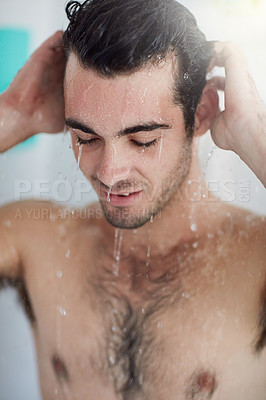 Buy stock photo Shot of a handsome young man having a refreshing shower at home
