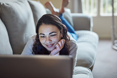 Buy stock photo Sofa, relax and woman in home on laptop, smile and streaming for video or movie. Online, subscription and technology with internet for happy female person, computer and couch in living room house