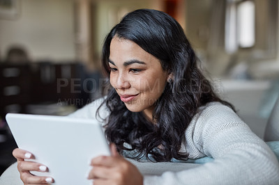 Buy stock photo Sofa, relax and woman in home on tablet, smile and streaming for video or movie. Online, subscription and technology with internet for happy female person, computer and couch in living room house