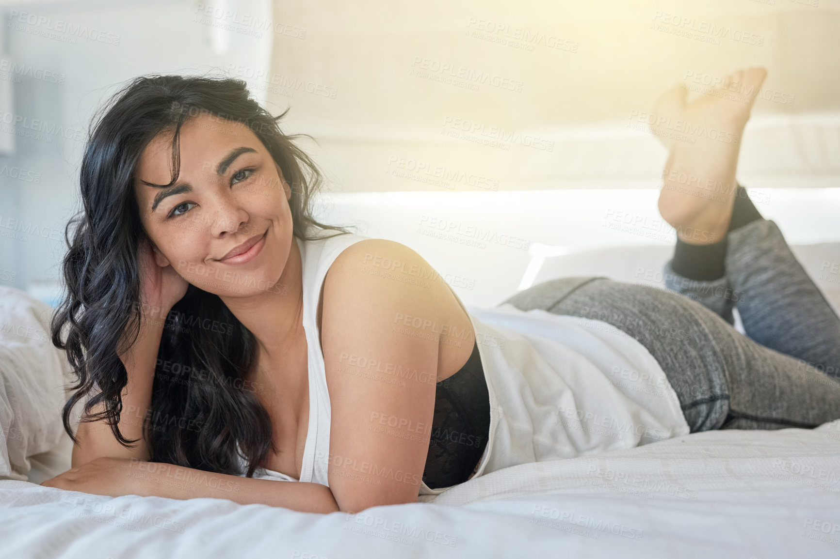 Buy stock photo Portrait, bed and woman for relax in bedroom, feet up or weekend calm in home. Peace, comfortable or lazy day for holiday in house, sleeping and wellness for body rest and self care for female person