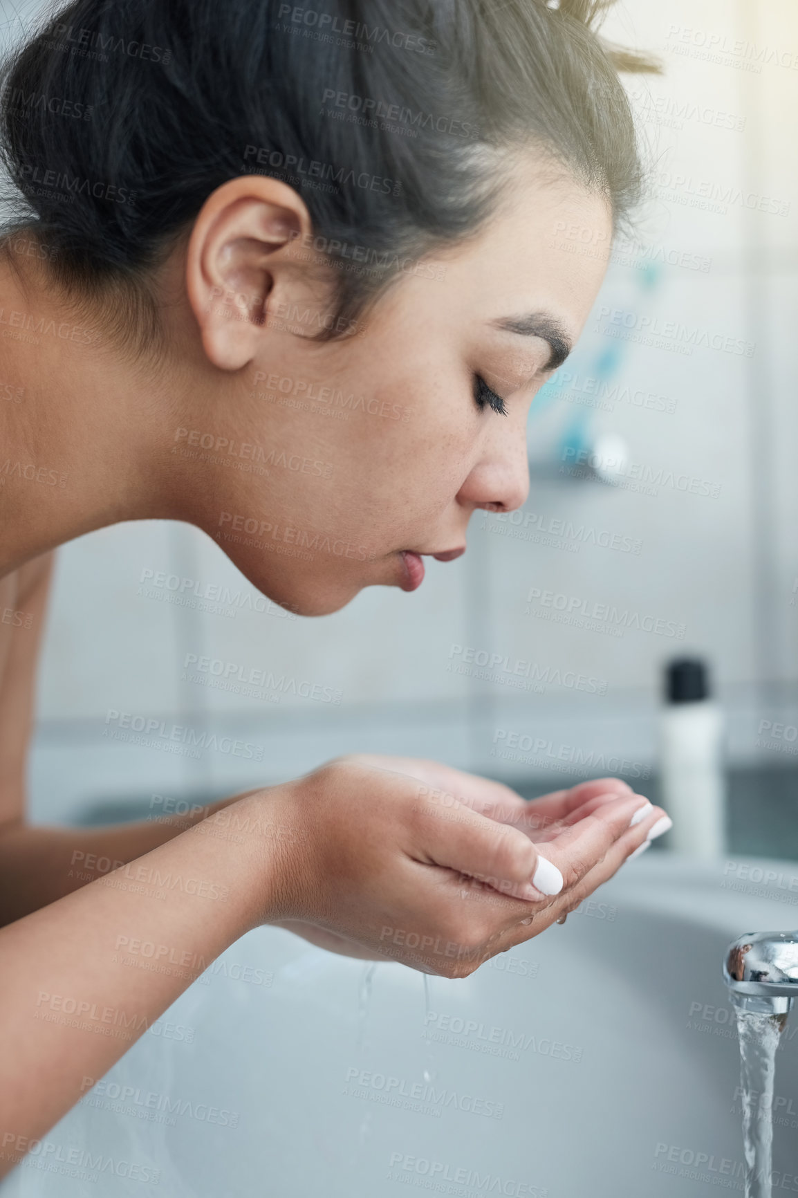 Buy stock photo Hands, washing face and woman with water for healthcare, hydration and morning routine in bathroom. Asian person, hygiene and sink with liquid for skincare, facial cleaning and wellness at home