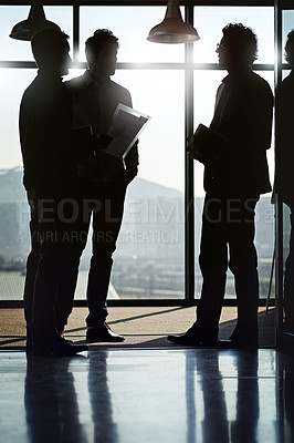 Buy stock photo Businessman, silhouette and meeting by window in office with documents by talking or planning with partners for project strategy. Team, men and workshop or conference for ideas on company development