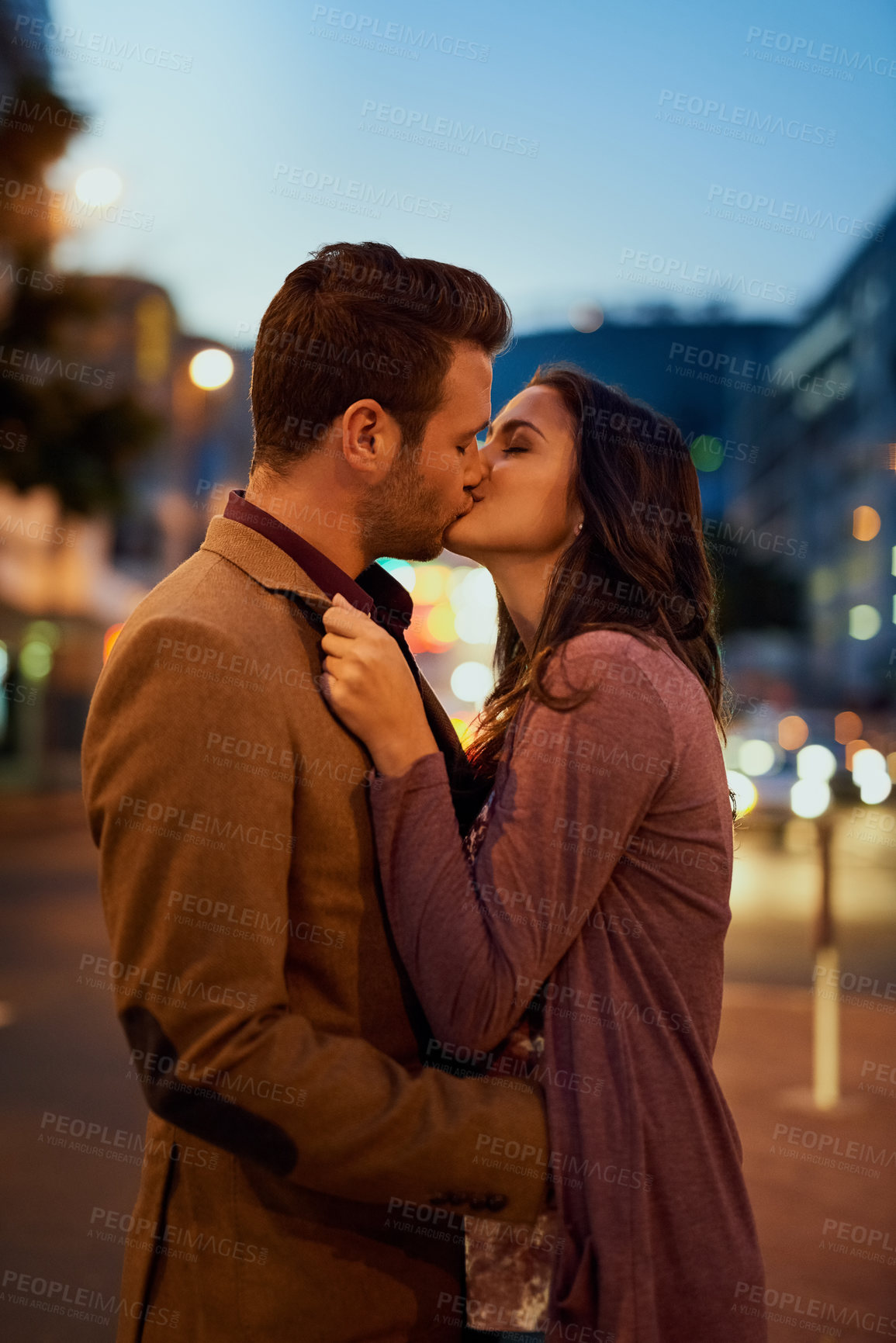 Buy stock photo Couple, night and city with kiss on date, romance and bonding with love in relationship. Happiness, affection and people with commitment and trust, sweet moment and romantic together outdoor